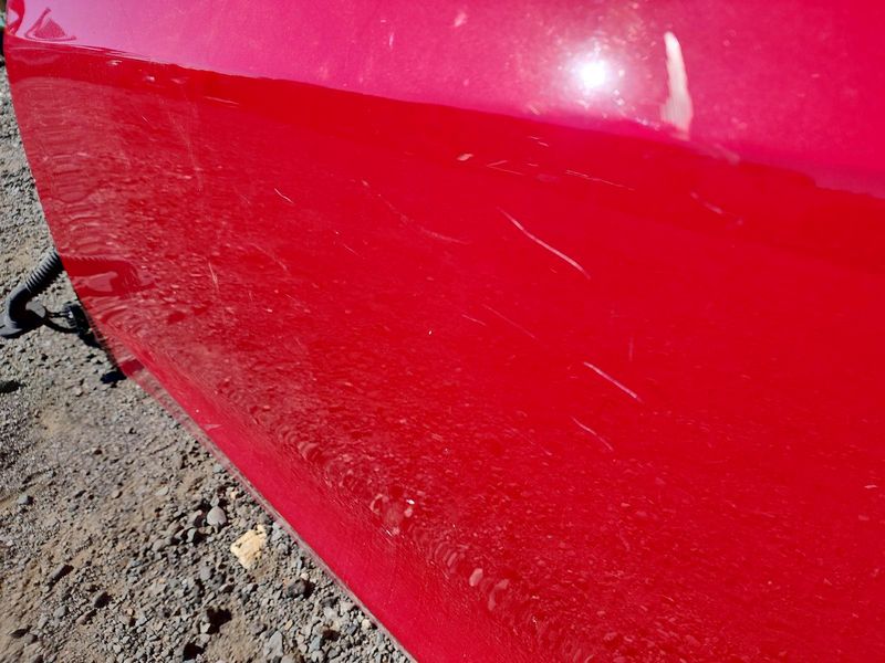 Used 2020 Tesla Model 3 front left door assembly red — part view 1; Elite stock EA1119