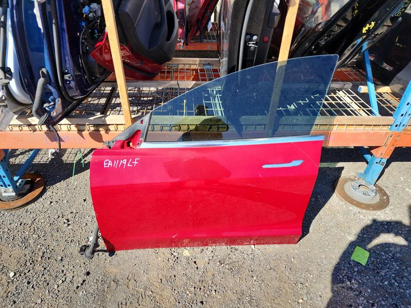 Used 2020 Tesla Model 3 front left door assembly red — part view 3; Elite stock EA1119